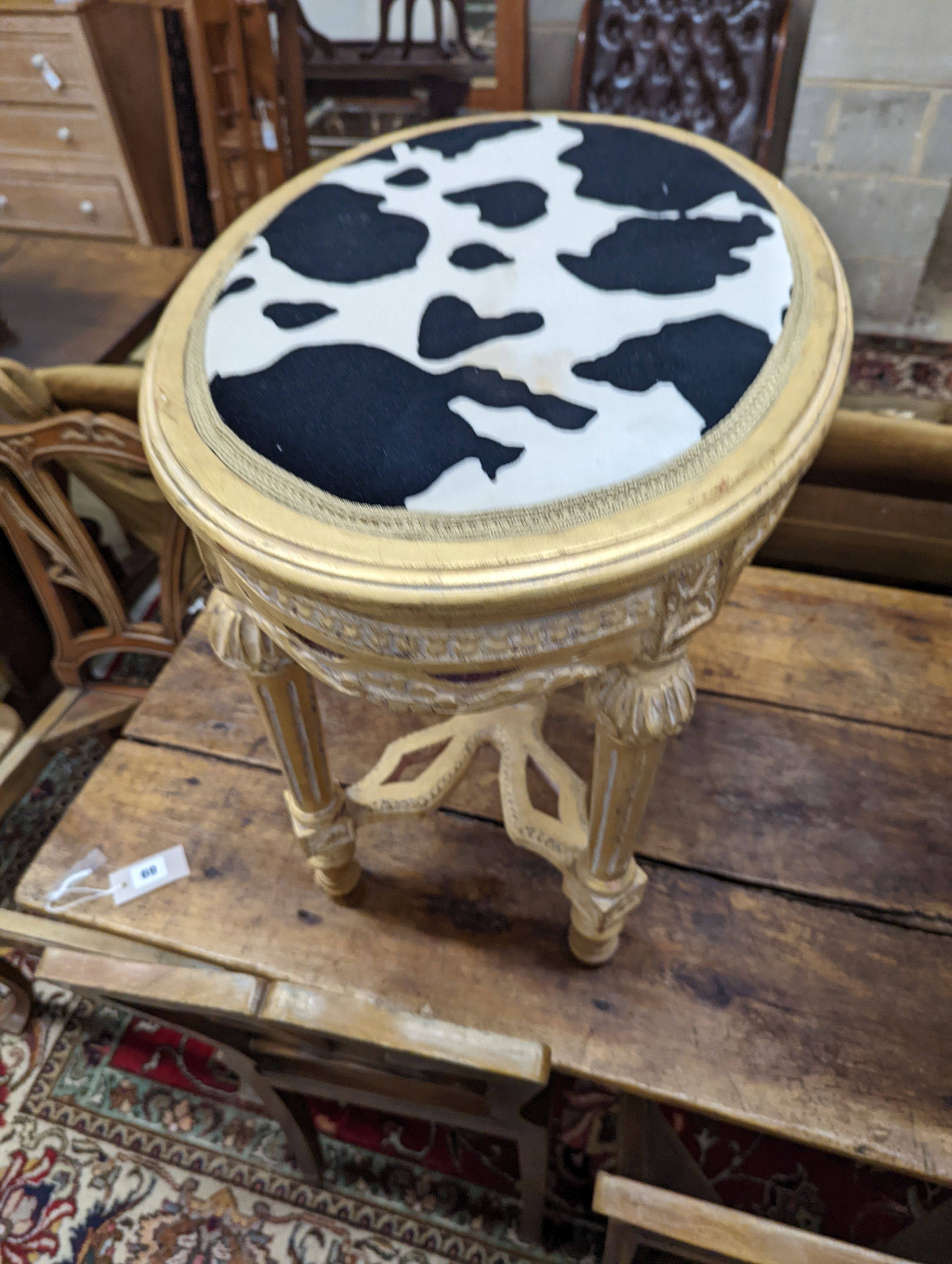 An oval gilt stool with faux zebra top, elbow chair and marble top occasional table. Chair height - 83cm.